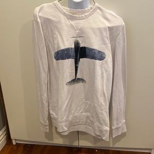 L sweater Label of Graded Goods. Off white long sleeve with an airplane as deco